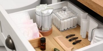 Say goodbye to bathroom clutter—this trick using candle holders and mirrors from Dollar Tree creates an elegant, inexpensive, three-tiered shelf that's perfect for keeping everything tidy